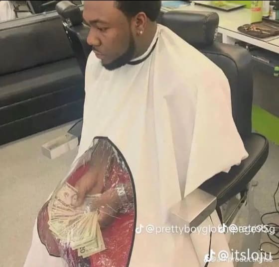 man at barber shop with money pic that goes hard